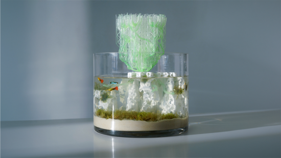 a large fishbowl with a 3d-printed component peaking out of the top